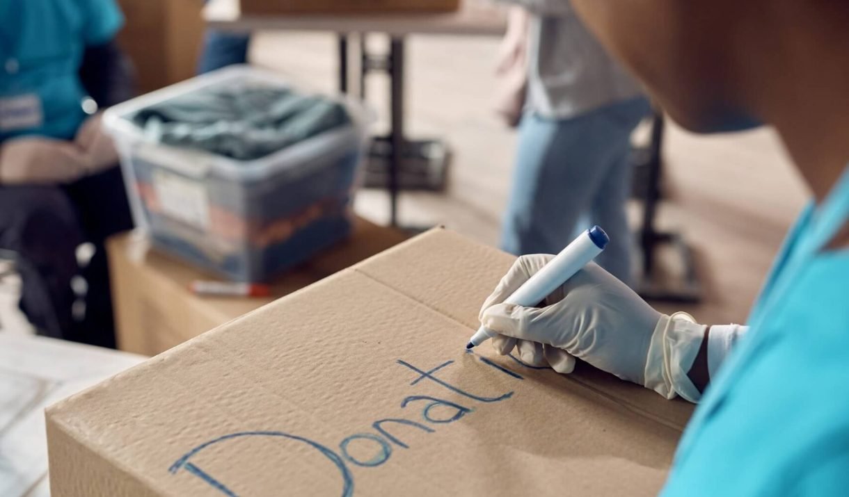 Close Up Of Woman Marking Donation Boxes While Vol 2022 11 16 14 40 42 Utc Scaled 1 1220x715