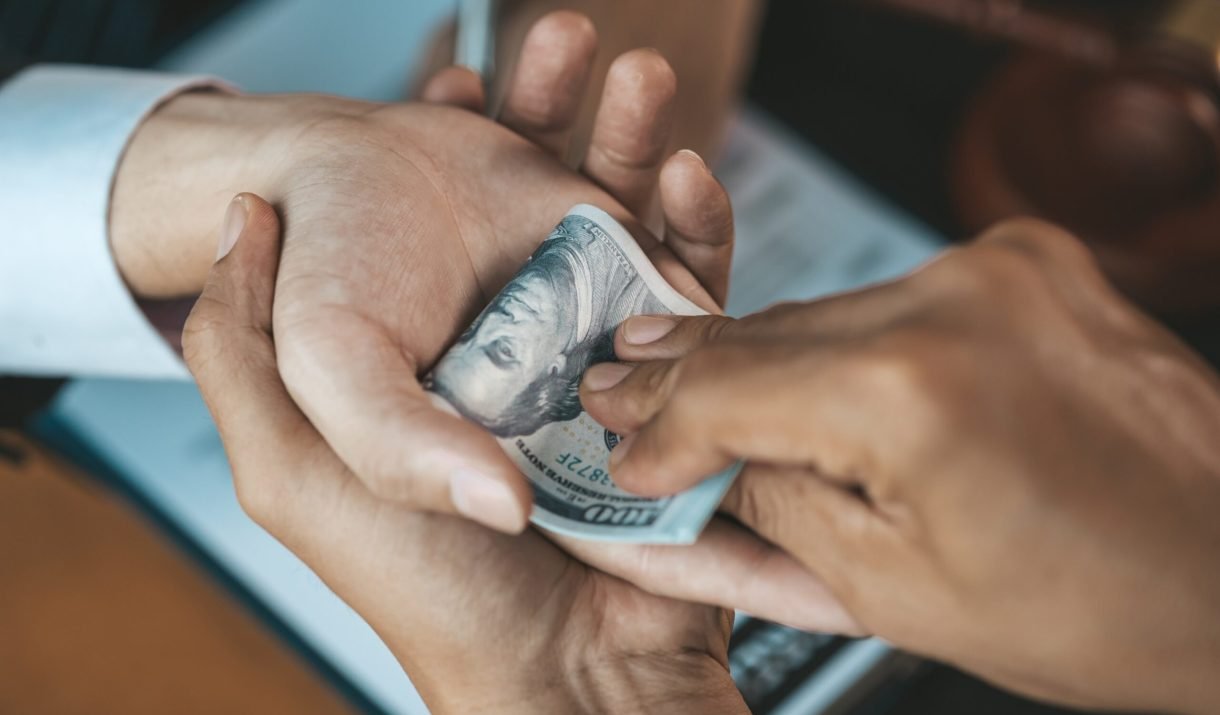 Individuals Are Giving Bribes To Officials In Orde WQZ4Z9H Scaled 1 1220x715