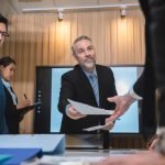group of businesspeople sitting together in a meeting for best ideas, international executive team