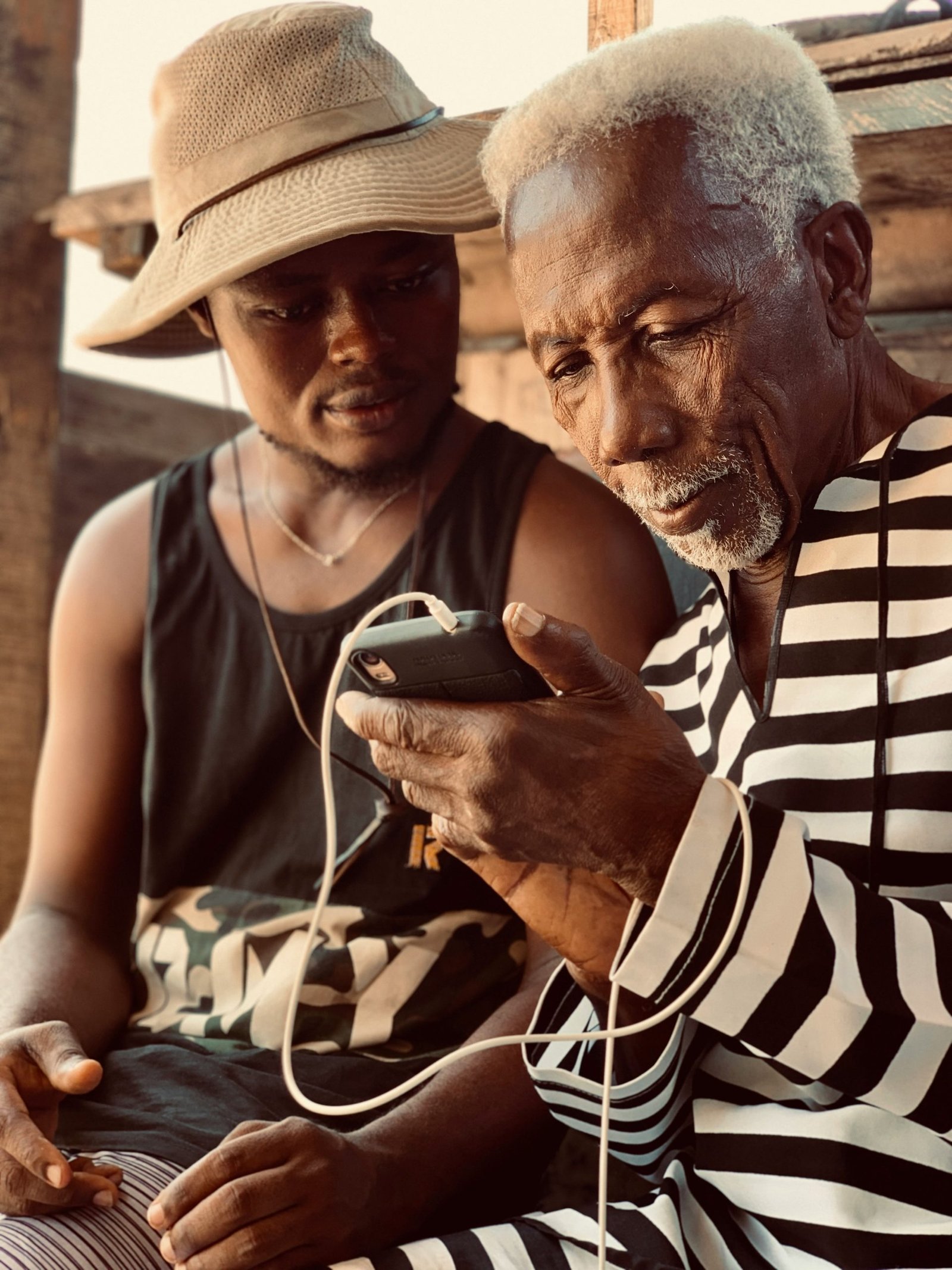 Origin Africa, two people watching their phones